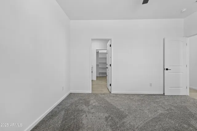 a spacious bathroom with double vanity and mirrors