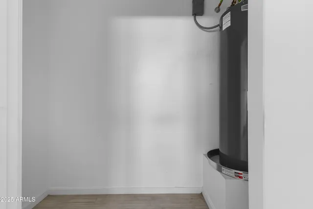 a view of a hallway with a ceiling fan