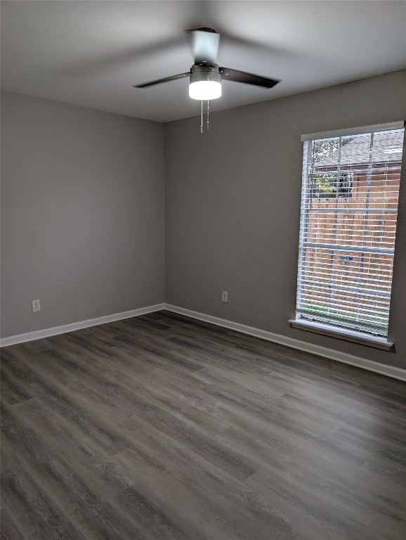 5102 Par Cove, Unit B Austin, TX 78744 - Photo 8 of 11 a view of an empty room with wooden floor and a window