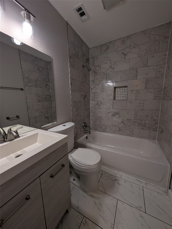 5102 Par Cove, Unit B Austin, TX 78744 - Photo 10 of 11 a bathroom with a sink toilet vanity and bathtub