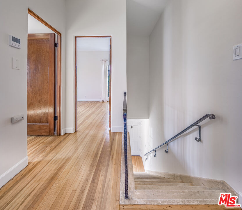 152 South Roxbury Drive, Unit 6 Beverly Hills, CA 90212 - Photo 15 of 51 a view of a hallway view with wooden floor and staircase