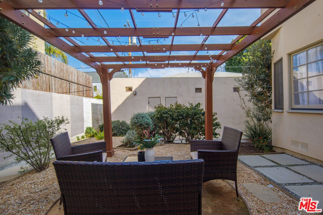 152 South Roxbury Drive, Unit 6 Beverly Hills, CA 90212 - Photo 29 of 51 a view of a porch with furniture and a potted plant