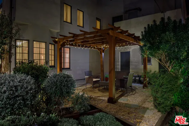 a view of backyard with patio