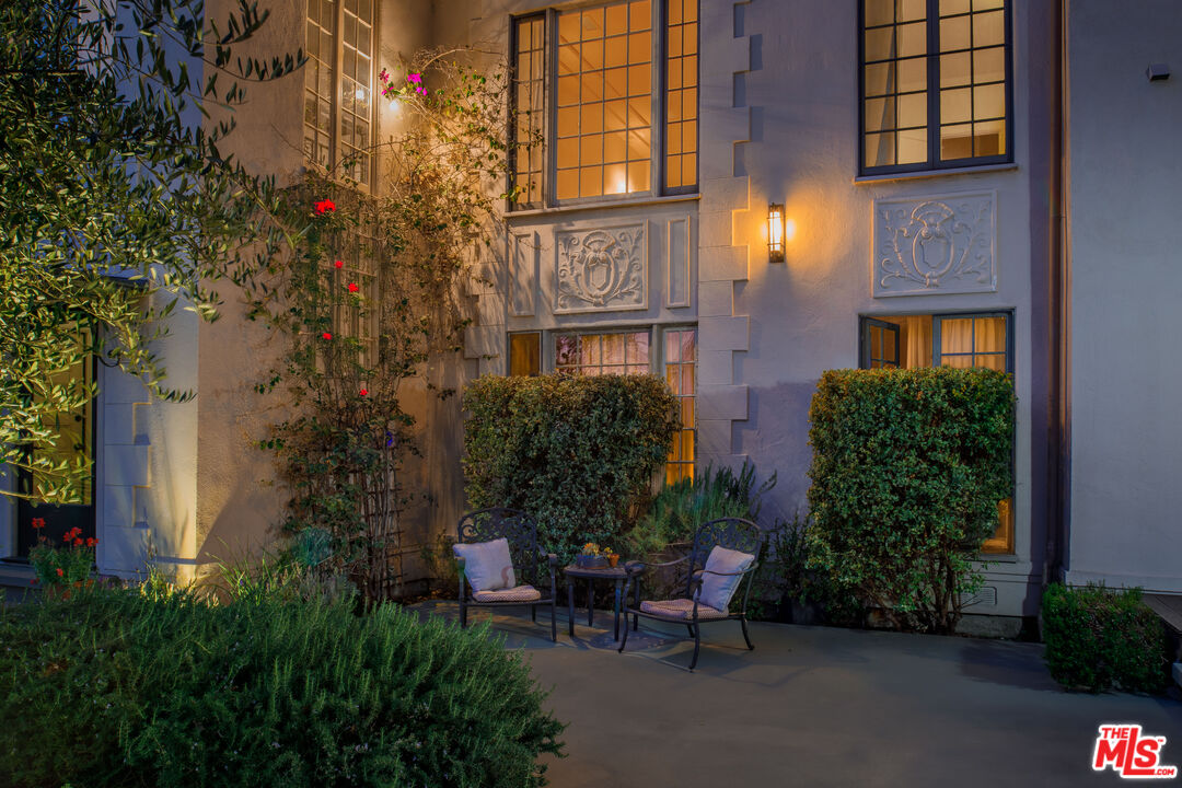 152 South Roxbury Drive, Unit 6 Beverly Hills, CA 90212 - Photo 5 of 51 front view of a brick house with a yard and plants
