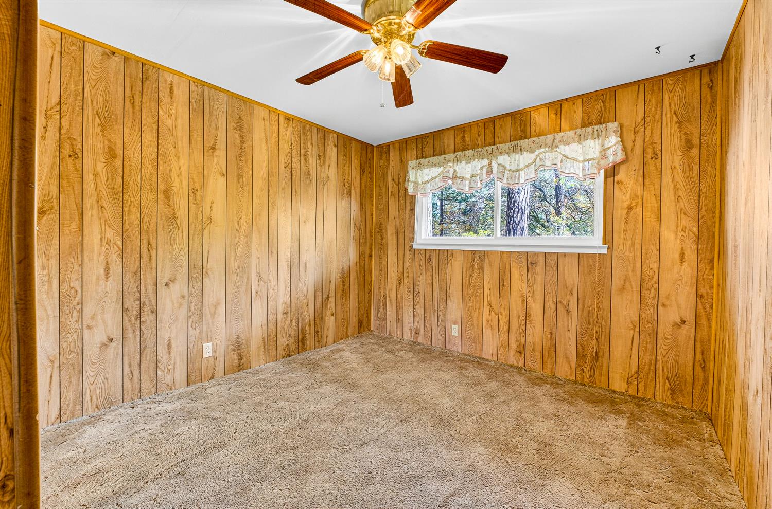 1130 Sage Road Colfax, CA 95713 - Photo 33 of 77 a view of a big room with windows and a chandelier fan
