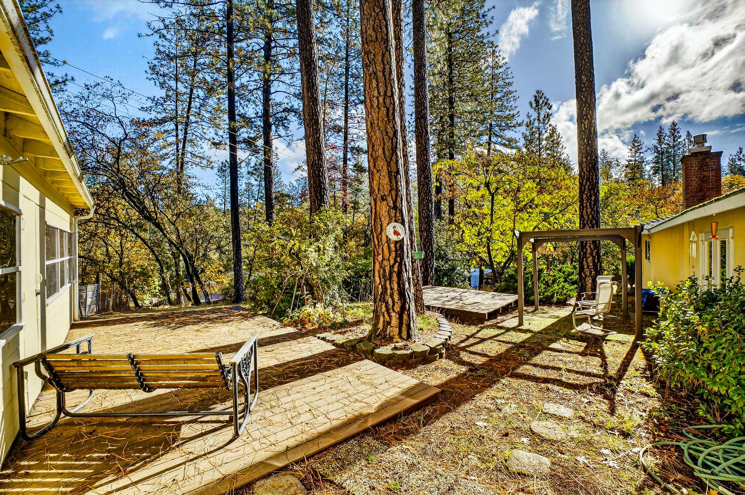 1130 Sage Road Colfax, CA 95713 - Photo 58 of 77 a view of a patio with table and chairs and potted plants