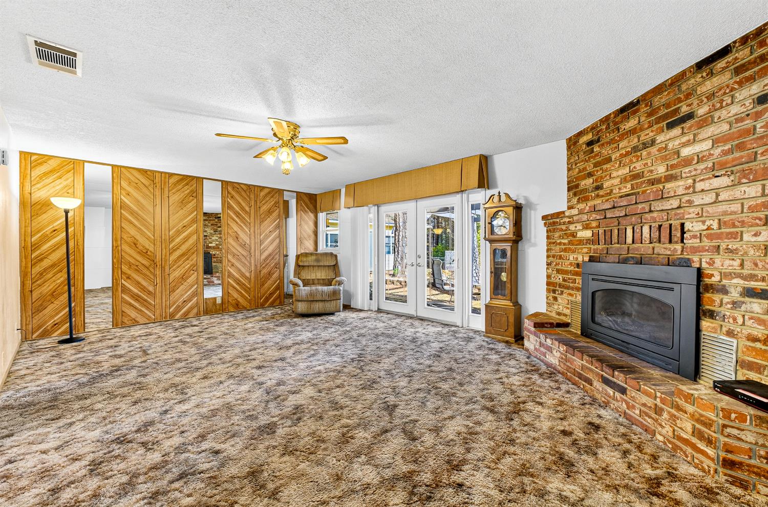 1130 Sage Road Colfax, CA 95713 - Photo 7 of 77 a living room with a fireplace furniture and a ceiling fan