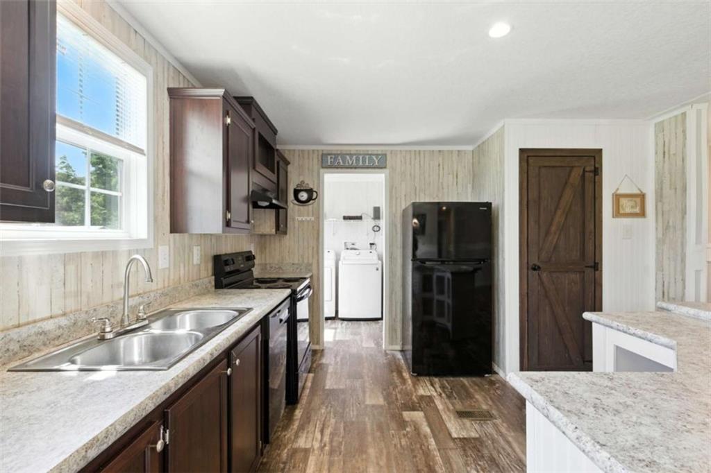 120 Beck Road Mount Airy, GA 30563 - Photo 12 of 30 a kitchen with a refrigerator sink and cabinets