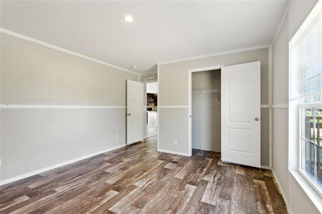 120 Beck Road Mount Airy, GA 30563 - Photo 17 of 30 a view of empty room with wooden floor and entryway