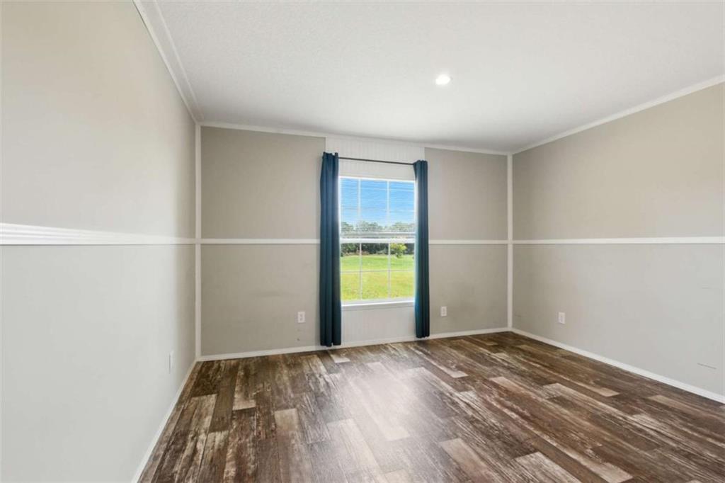 120 Beck Road Mount Airy, GA 30563 - Photo 18 of 30 a view of an empty room with wooden floor