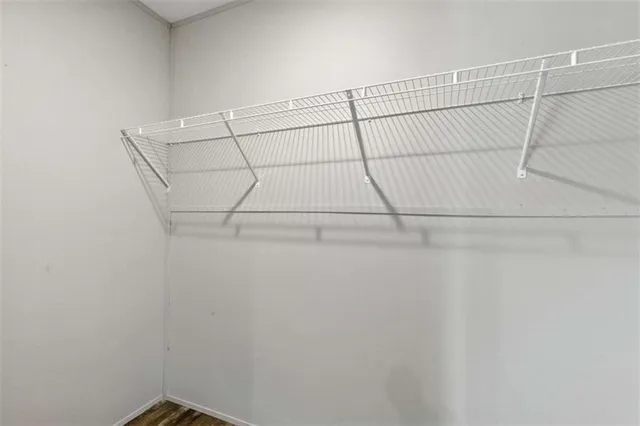 a bathroom with a granite countertop toilet and a sink