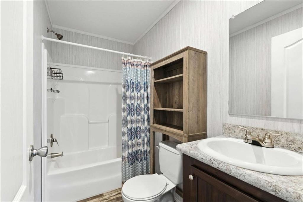 120 Beck Road Mount Airy, GA 30563 - Photo 25 of 30 a bathroom with a sink toilet and shower