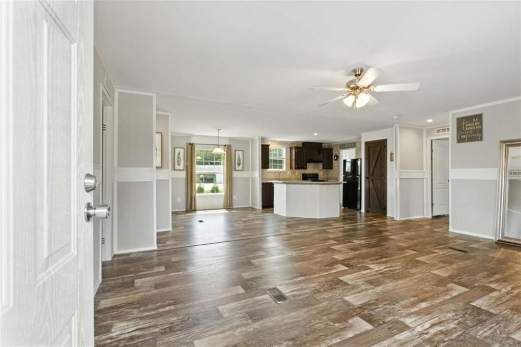 120 Beck Road Mount Airy, GA 30563 - Photo 4 of 30 a view of a kitchen with a stove cabinets and wooden floor