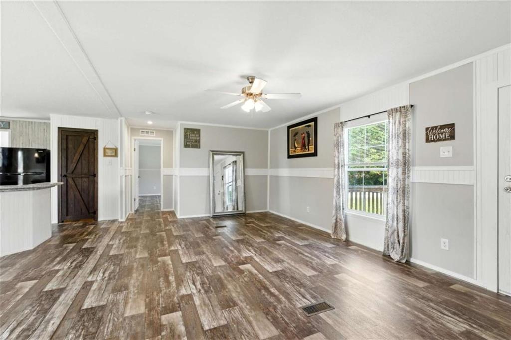 120 Beck Road Mount Airy, GA 30563 - Photo 6 of 30 a view of a bedroom with a bed and wooden floor