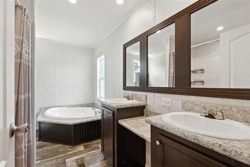 120 Beck Road Mount Airy, GA 30563 - Photo 9 of 30 a bathroom with a sink and a mirror