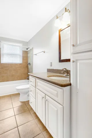 a bathroom with a sink a toilet and bathtub