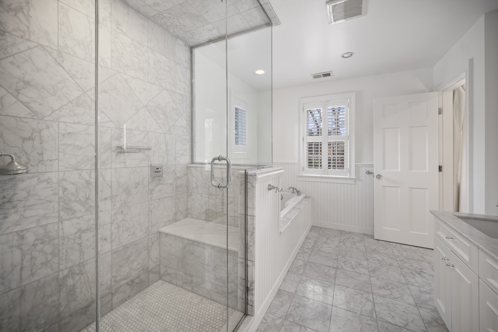 135 Plympton Road Sudbury, MA 01776 - Photo 28 of 42 a spacious bathroom with a bathtub and shower