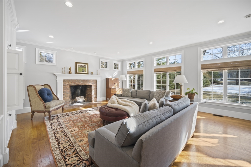 135 Plympton Road Sudbury, MA 01776 - Photo 4 of 42 a living room with furniture and a fireplace