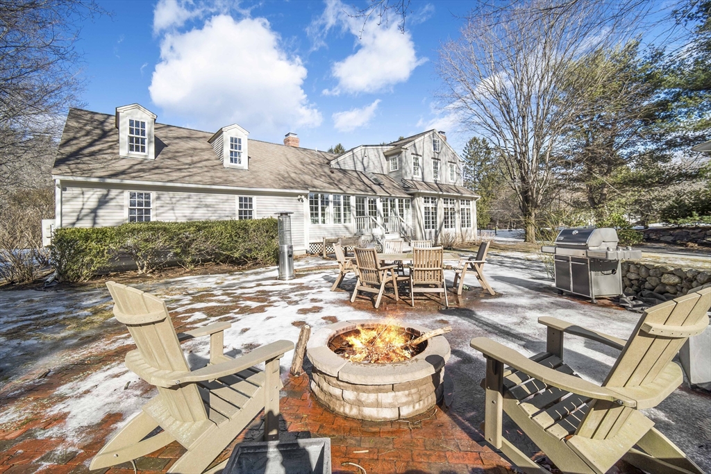 135 Plympton Road Sudbury, MA 01776 - Photo 41 of 42 a view of a patio with swimming pool
