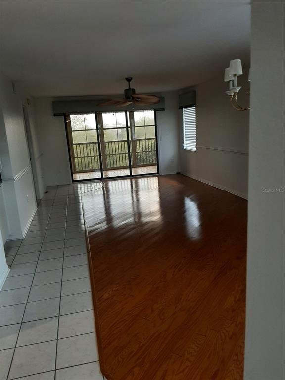 175 Kings Highway, Unit C8 Punta Gorda, FL 33983 - Photo 18 of 20 wooden floor in an empty room with a window