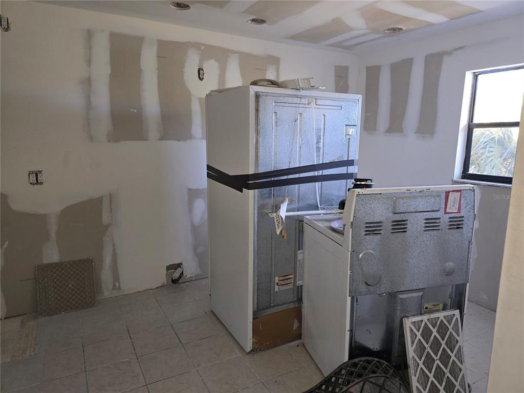 175 Kings Highway, Unit C8 Punta Gorda, FL 33983 - Photo 3 of 20 a room with storage and utility