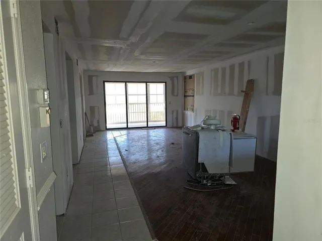 a view of entryway with kitchen