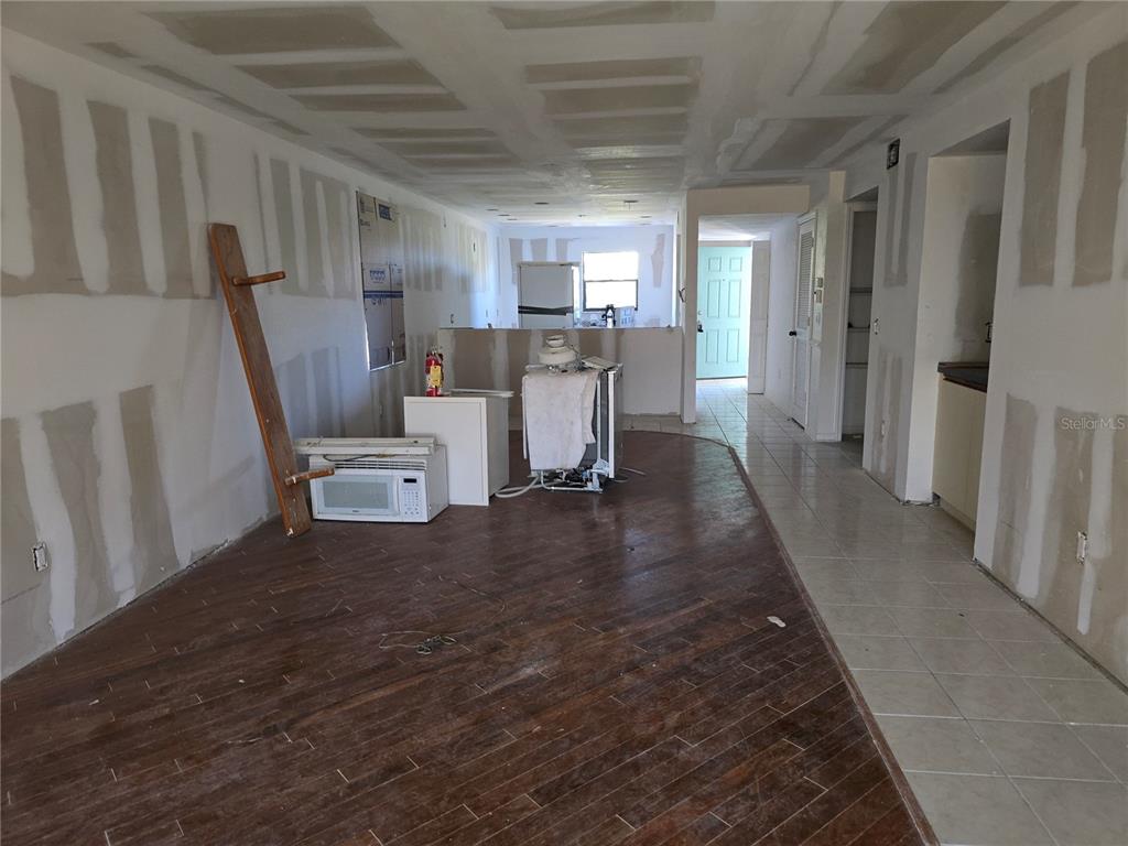 175 Kings Highway, Unit C8 Punta Gorda, FL 33983 - Photo 5 of 20 a view of a kitchen with furniture and wooden floor