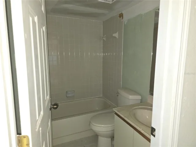 a bathroom with a shower and a toilet