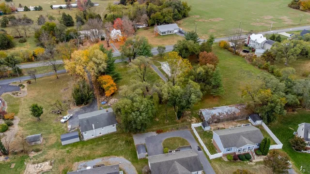an aerial view of residential house with outdoor space and swimming pool