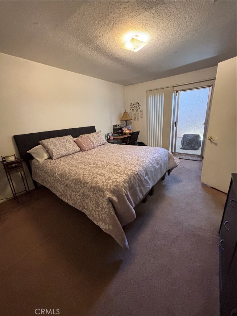 107 East Baseline Road San Dimas, CA 91773 - Photo 13 of 52 a bed sitting in a spacious bedroom next to a window
