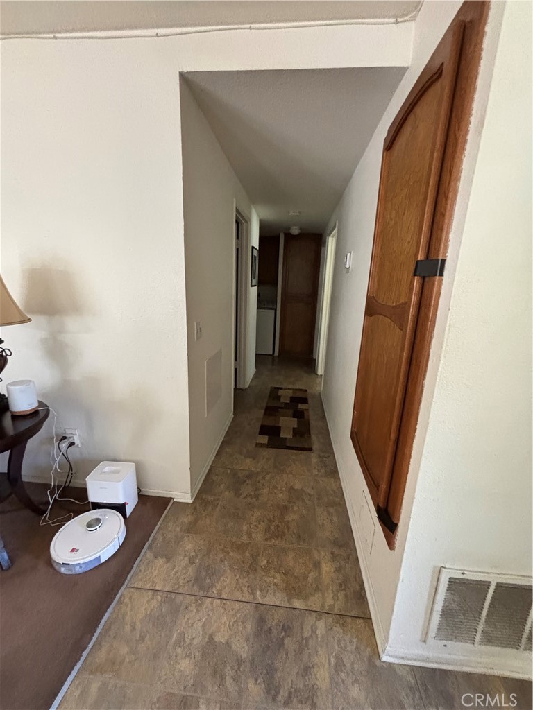 107 East Baseline Road San Dimas, CA 91773 - Photo 16 of 52 a view of a hallway with furniture and wooden floor