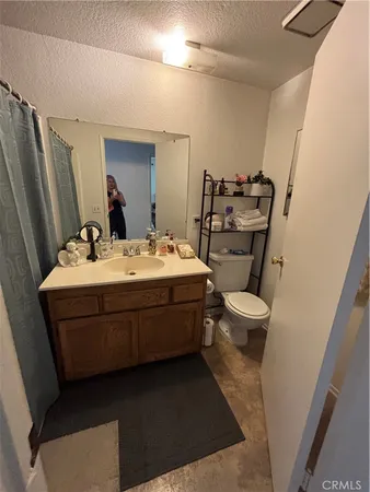 a bathroom with a double vanity sink and mirror