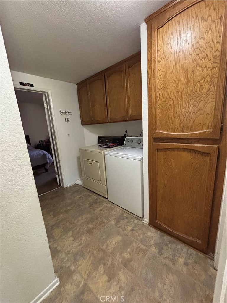 107 East Baseline Road San Dimas, CA 91773 - Photo 25 of 52 a storage room with wooden floor washer and dryer