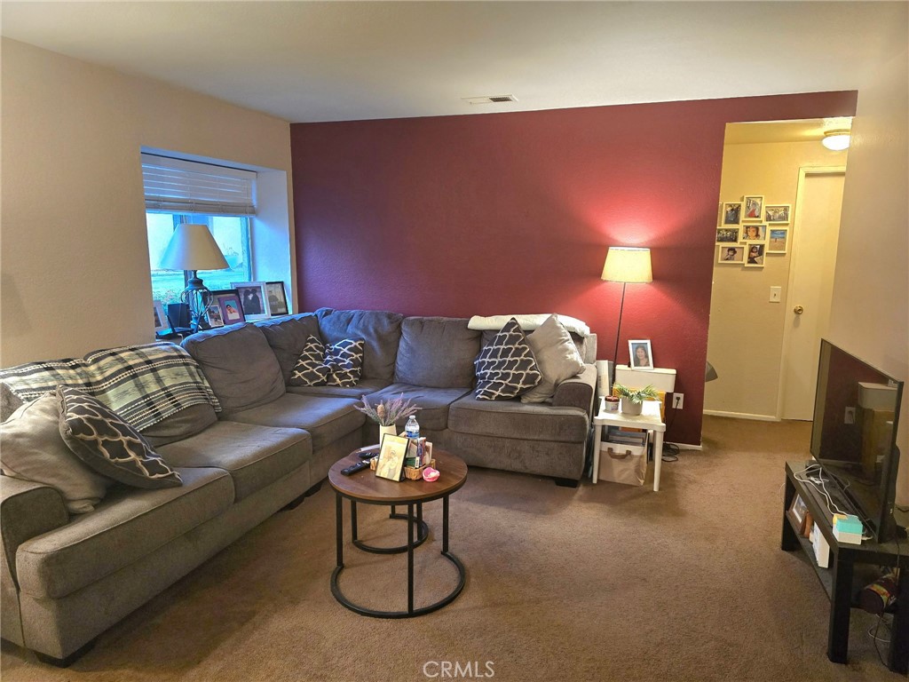 107 East Baseline Road San Dimas, CA 91773 - Photo 32 of 52 a living room with furniture and a fireplace