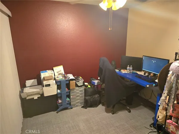 a kitchen with sink a microwave and cabinets