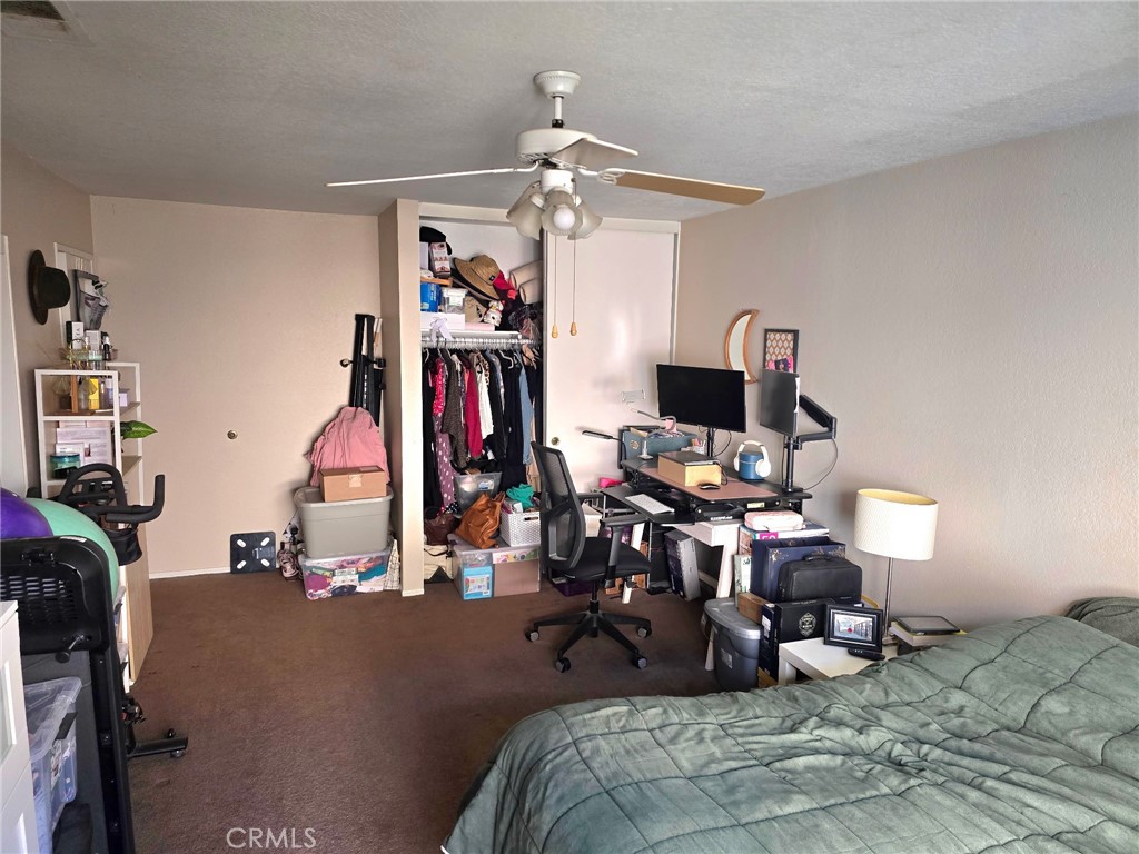 107 East Baseline Road San Dimas, CA 91773 - Photo 39 of 52 a bedroom with bed a flat tv screen and a dresser