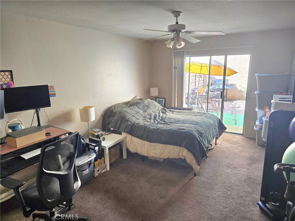 107 East Baseline Road San Dimas, CA 91773 - Photo 41 of 52 a bedroom with a bed a computer on the desk and a window