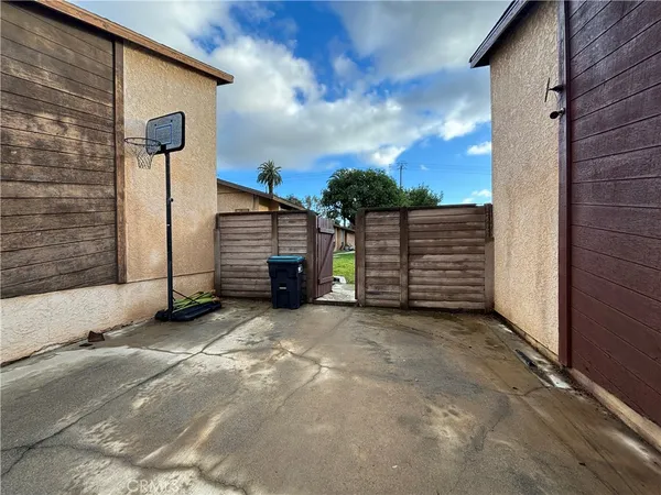 a view of a backyard with potted plants