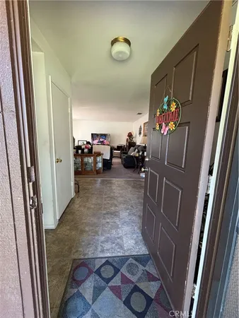 a view of living room with furniture and a flat screen tv