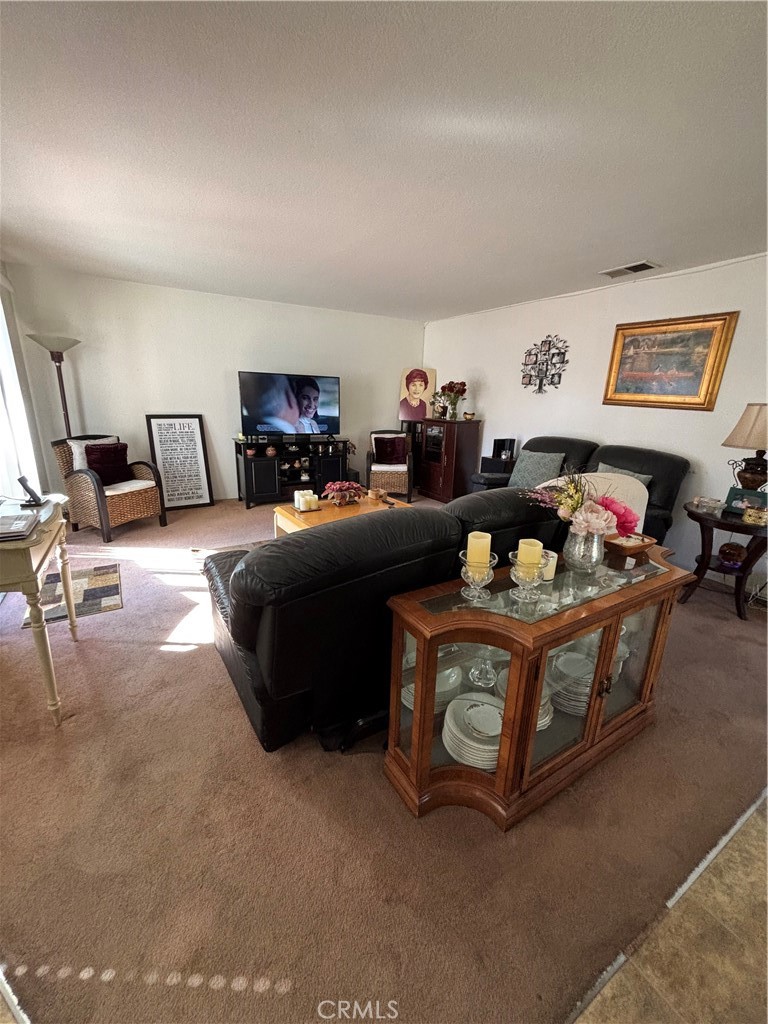 107 East Baseline Road San Dimas, CA 91773 - Photo 10 of 52 a living room with furniture and a couch