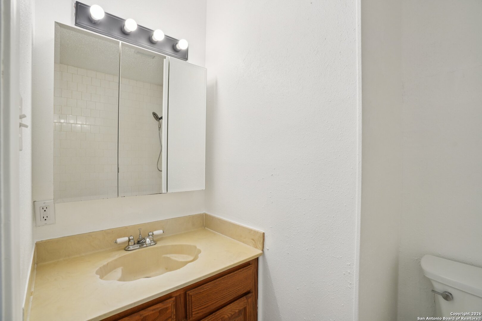 1012 Dimrock Schertz, TX 78154 - Photo 11 of 20 a bathroom with a sink and a mirror