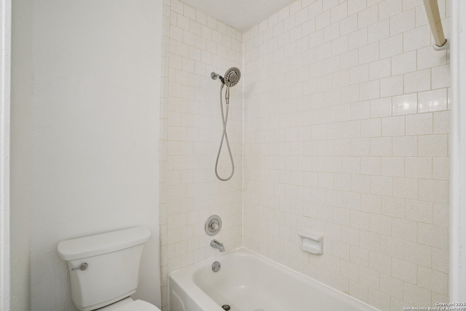 1012 Dimrock Schertz, TX 78154 - Photo 12 of 20 a bathroom with a granite countertop toilet and a bath tub