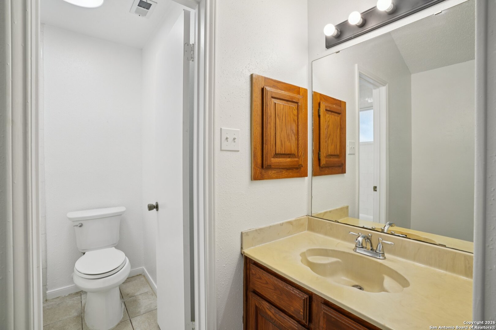 1012 Dimrock Schertz, TX 78154 - Photo 15 of 20 a bathroom with a sink a toilet and shower