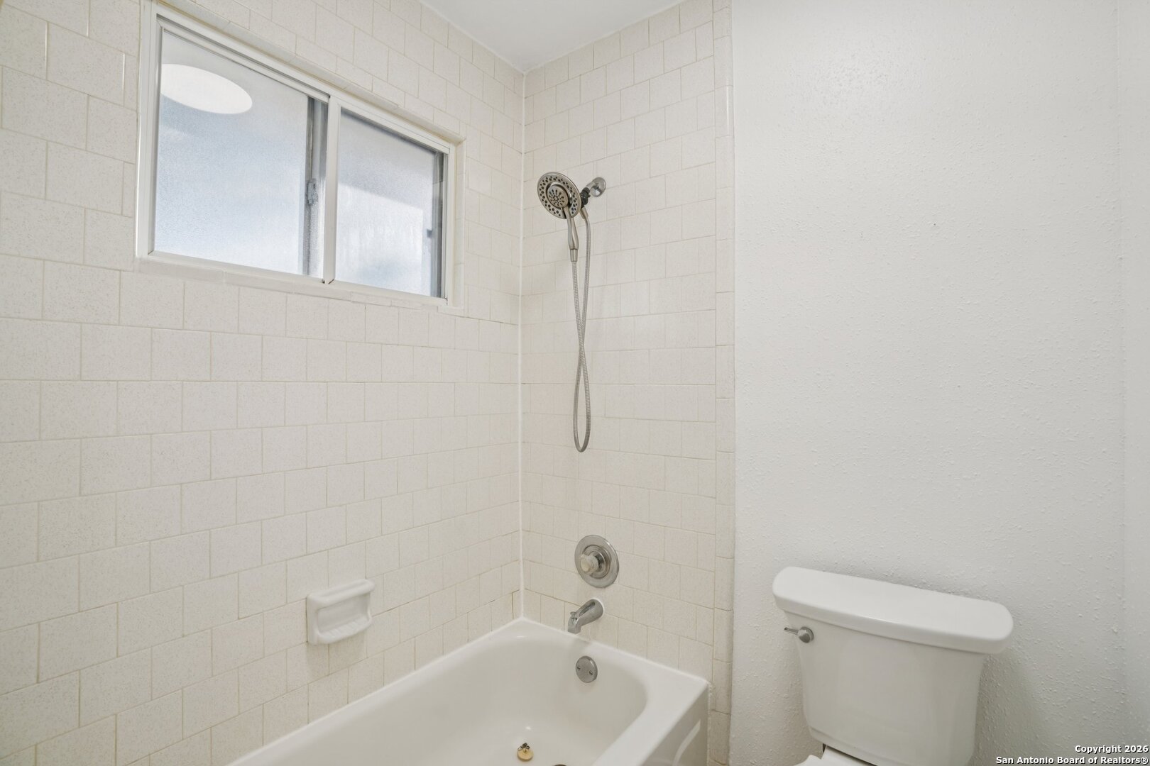 1012 Dimrock Schertz, TX 78154 - Photo 16 of 20 a bathroom with a sink a toilet and shower