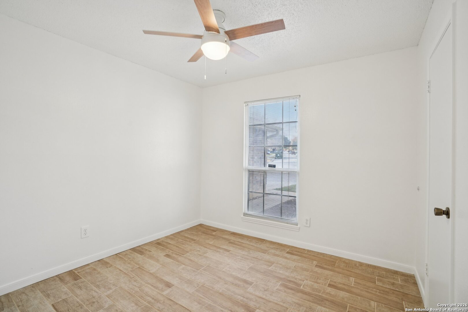1012 Dimrock Schertz, TX 78154 - Photo 10 of 20 an empty room with a empty space and a ceiling fan