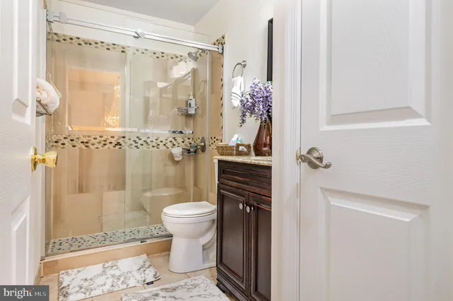 a bedroom with a bed and a table in it