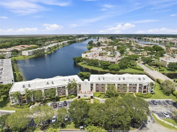 a view of a lake with big yard