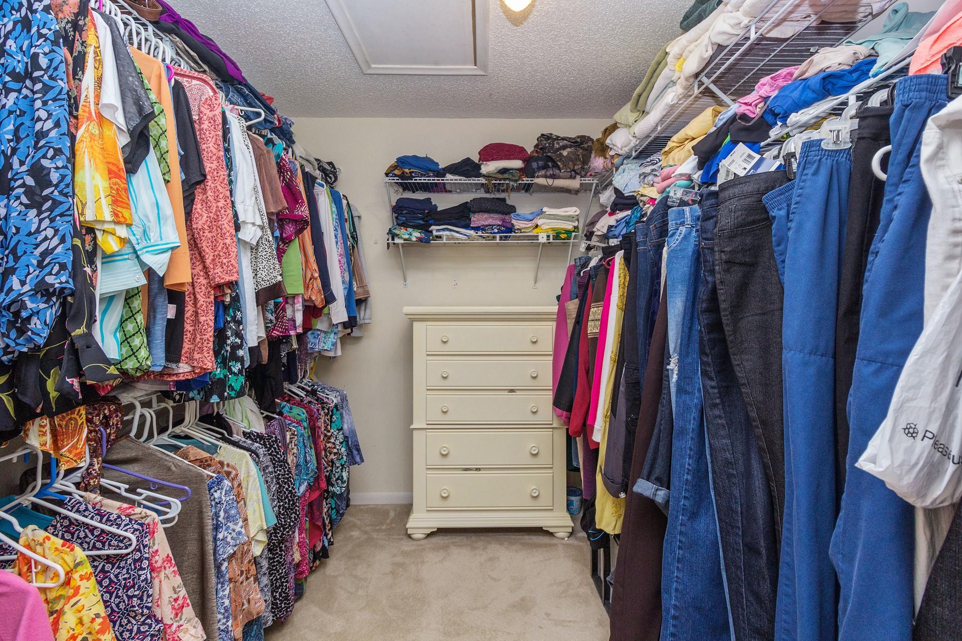 7883 Cloverfield Circle Boca Raton, FL 33433 - Photo 17 of 25 a view of walk in closet with clothes and shoes