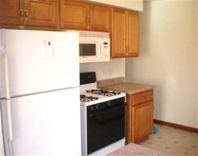 1549 Shell Street Hammond, IN 46320 - Photo 5 of 10 a kitchen with stainless steel appliances granite countertop a stove a microwave and a refrigerator