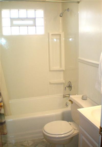 1549 Shell Street Hammond, IN 46320 - Photo 8 of 10 a bathroom with a toilet a sink and bathtub